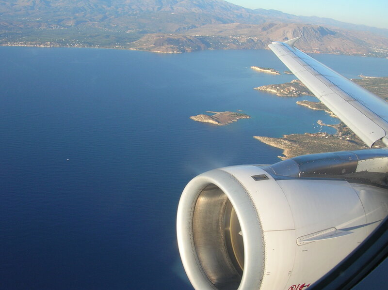 Airplane Wing over Sea — Blue