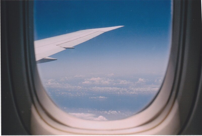 Airplane Wing View — Blue, Serene, Afternoon, Photograph