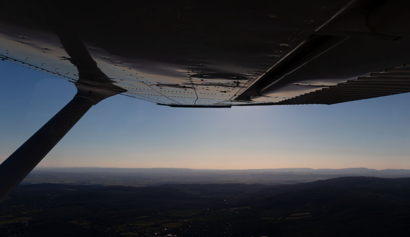 Airplane Wing View — Blue, Serene, Sunset