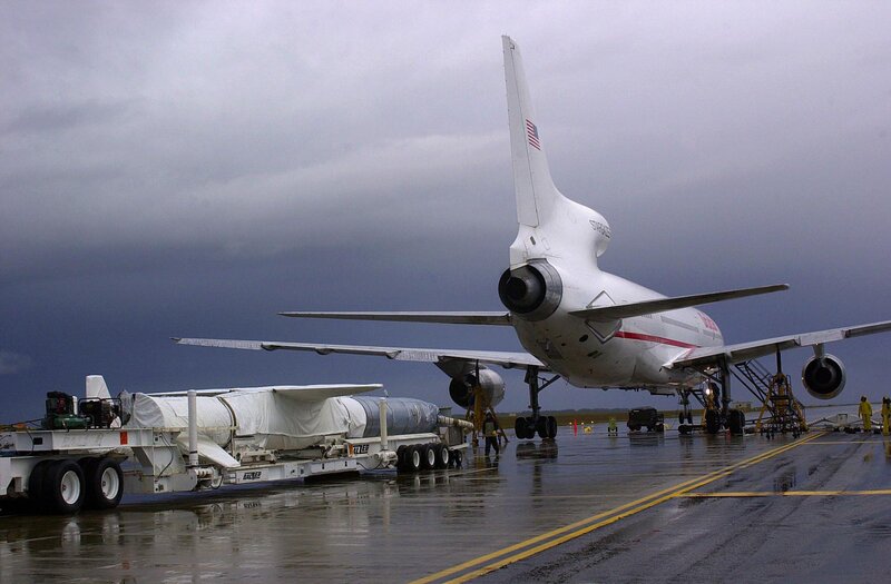 Airplane with missile on tarmac