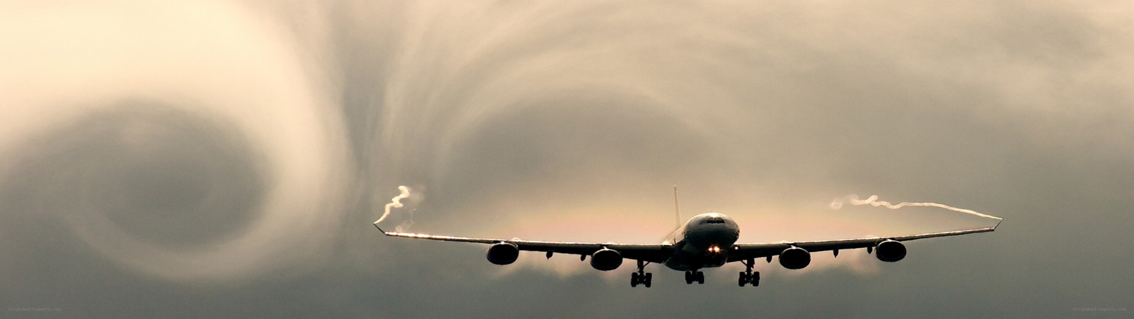 airplane with wingtip vortices
