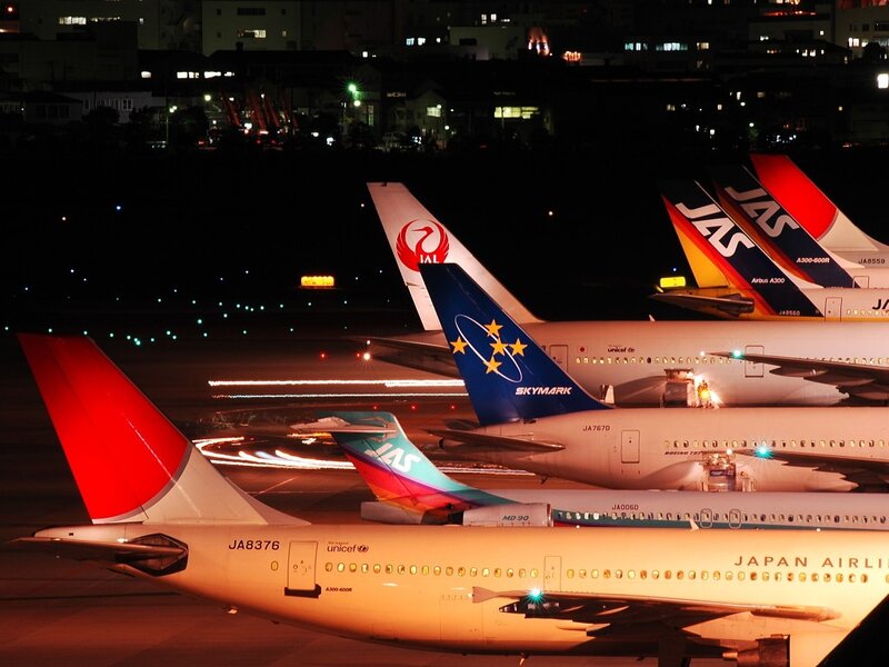 Airplanes at night on tarmac