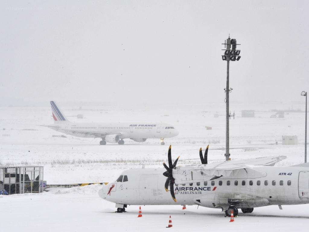 Airplanes at snowy airport