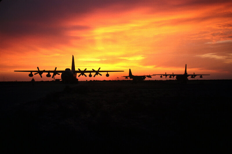 Airplanes at sunset on tarmac