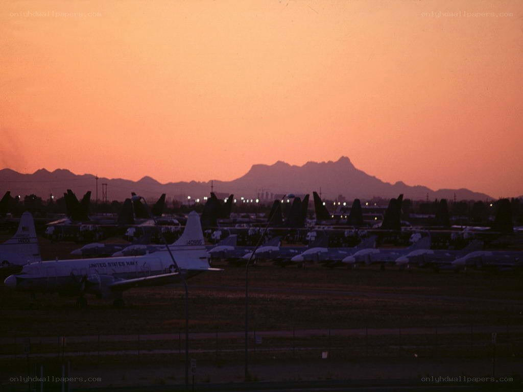 Airplanes at sunset with mountains