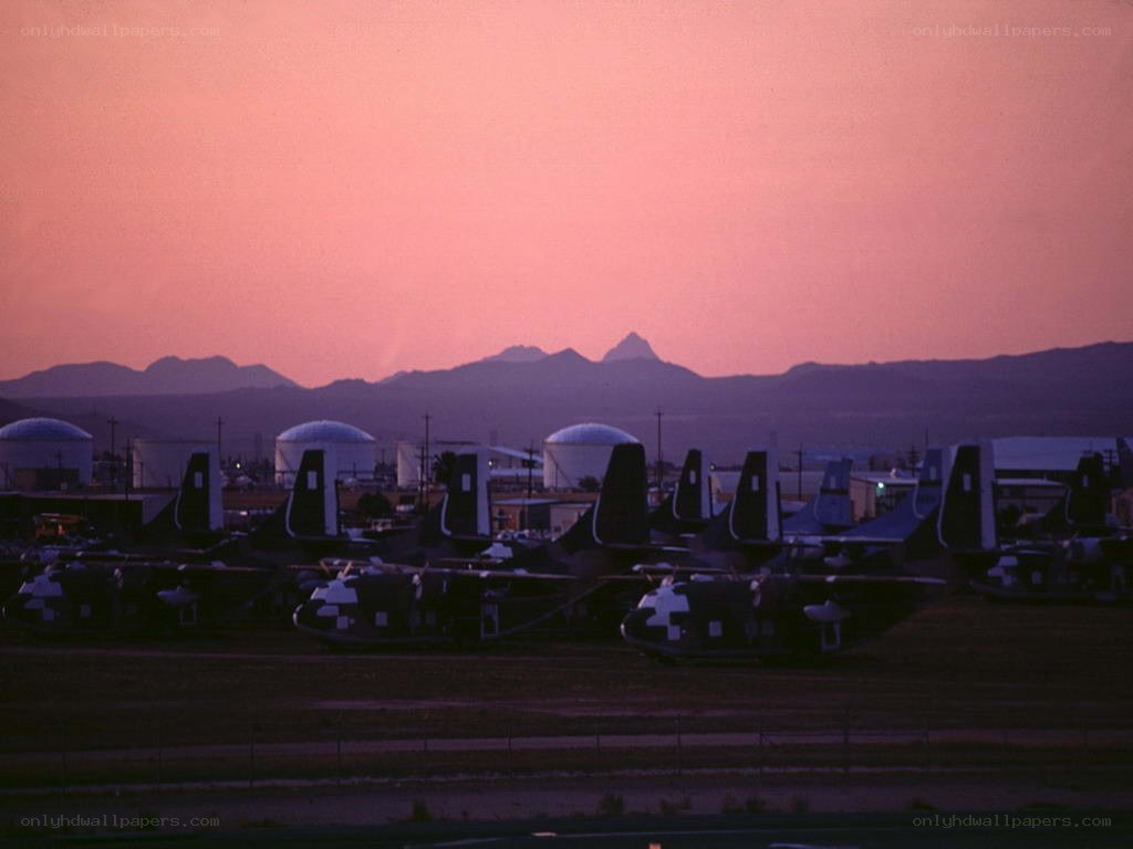 Airplanes at sunset with mountains