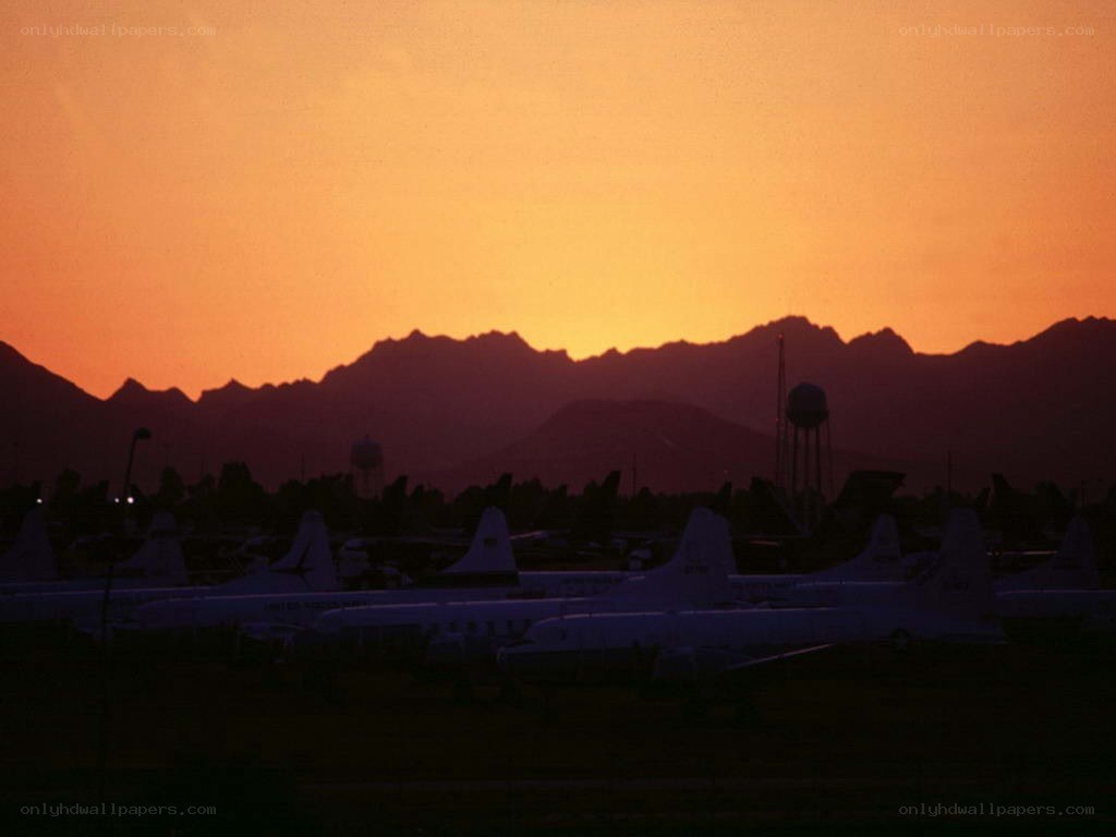 Airplanes at sunset with mountains