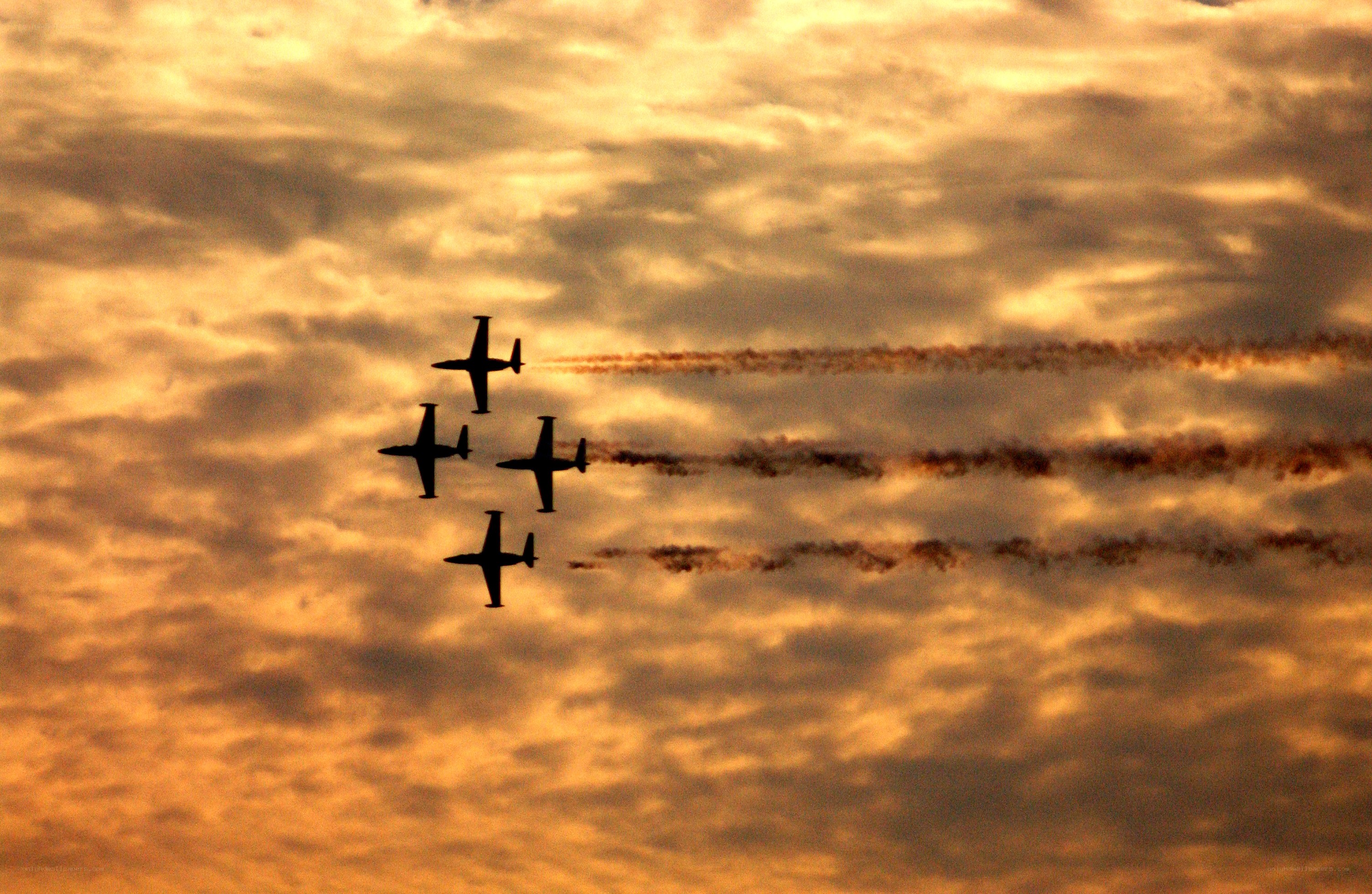 Airplanes in formation at sunset