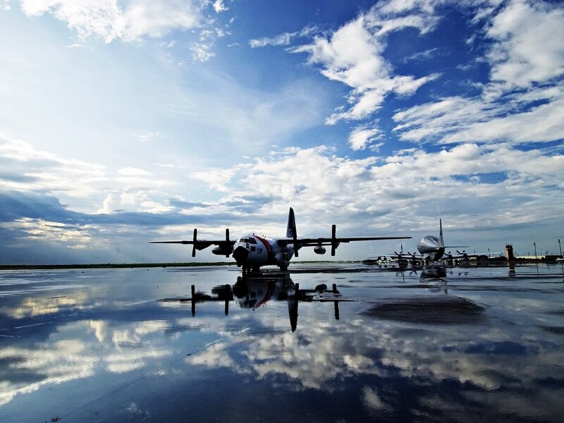 Airplanes on Wet Tarmac — Blue