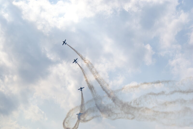 Airplanes performing aerial maneuvers