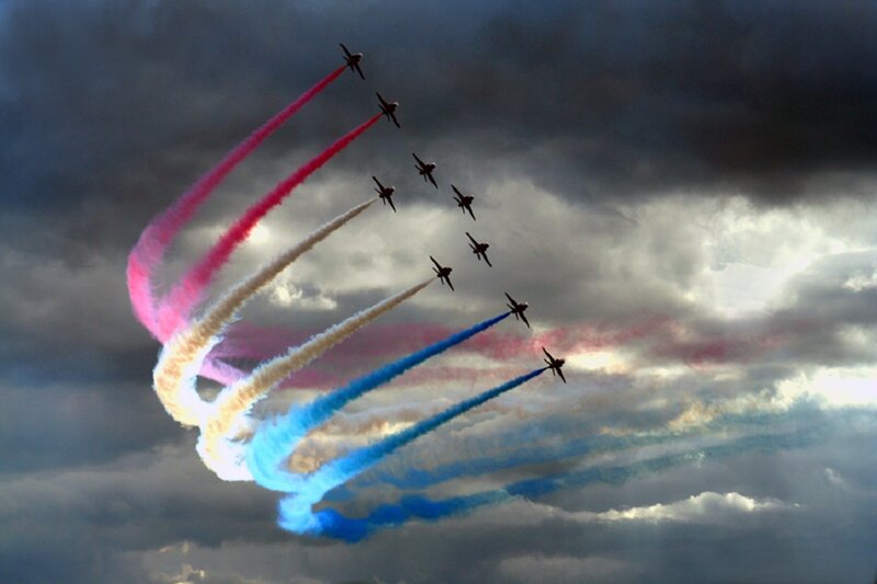 Airplanes Performing Aerobatics — Blue