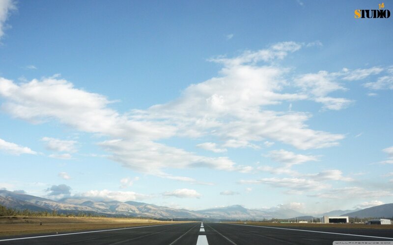 Airport runway with mountains
