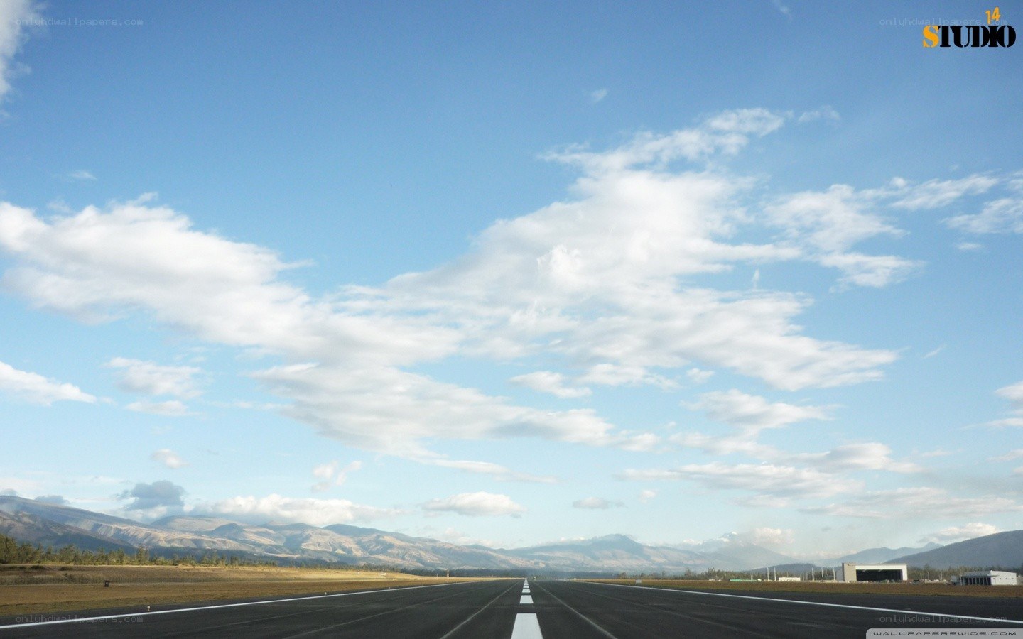 Airport runway with mountains
