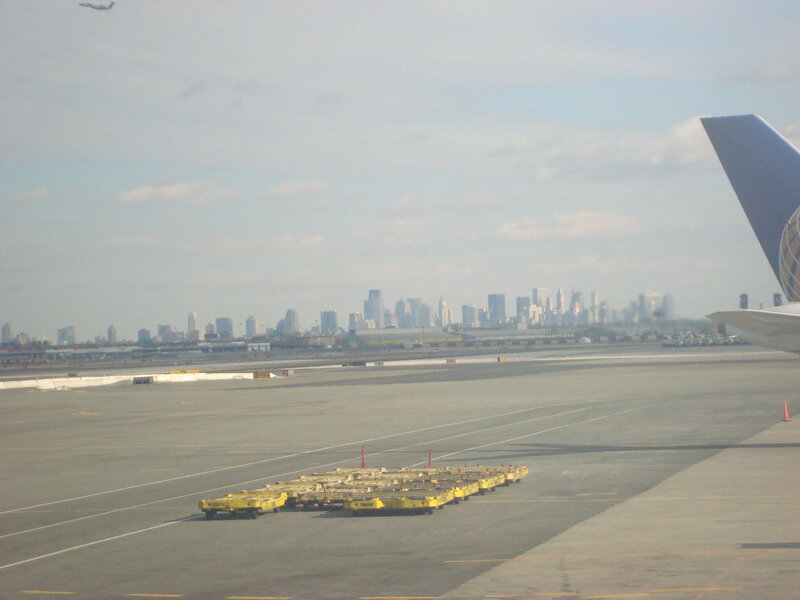 Airport tarmac with city skyline