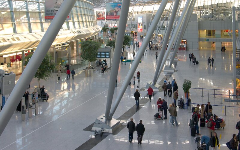 Airport terminal with travelers