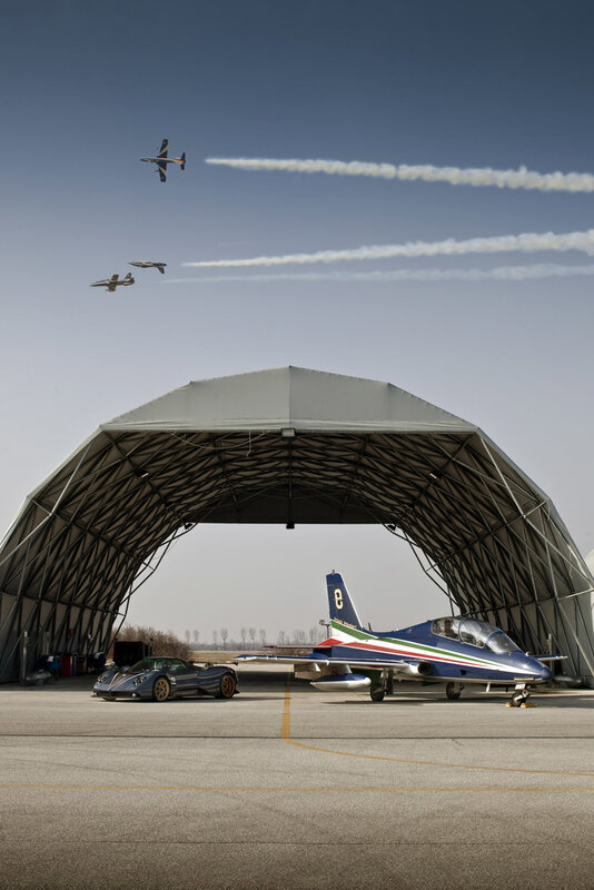 Airshow planes and car at airfield