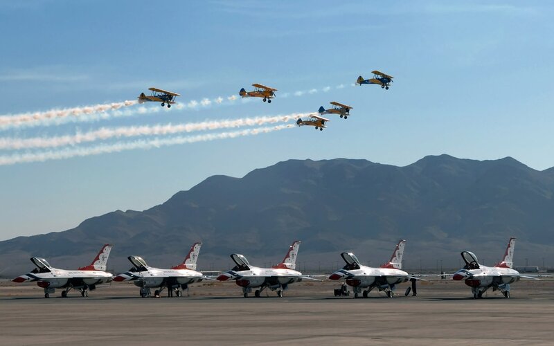 Airshow with jets and biplanes