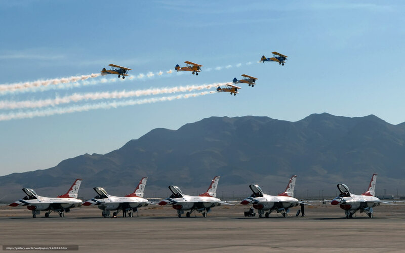 Airshow with jets and biplanes