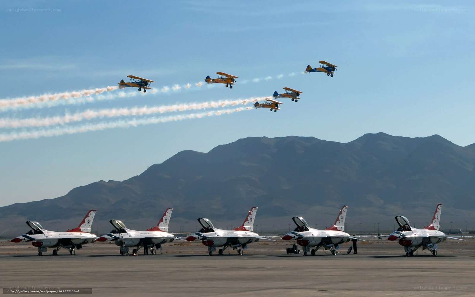 Airshow with jets and biplanes