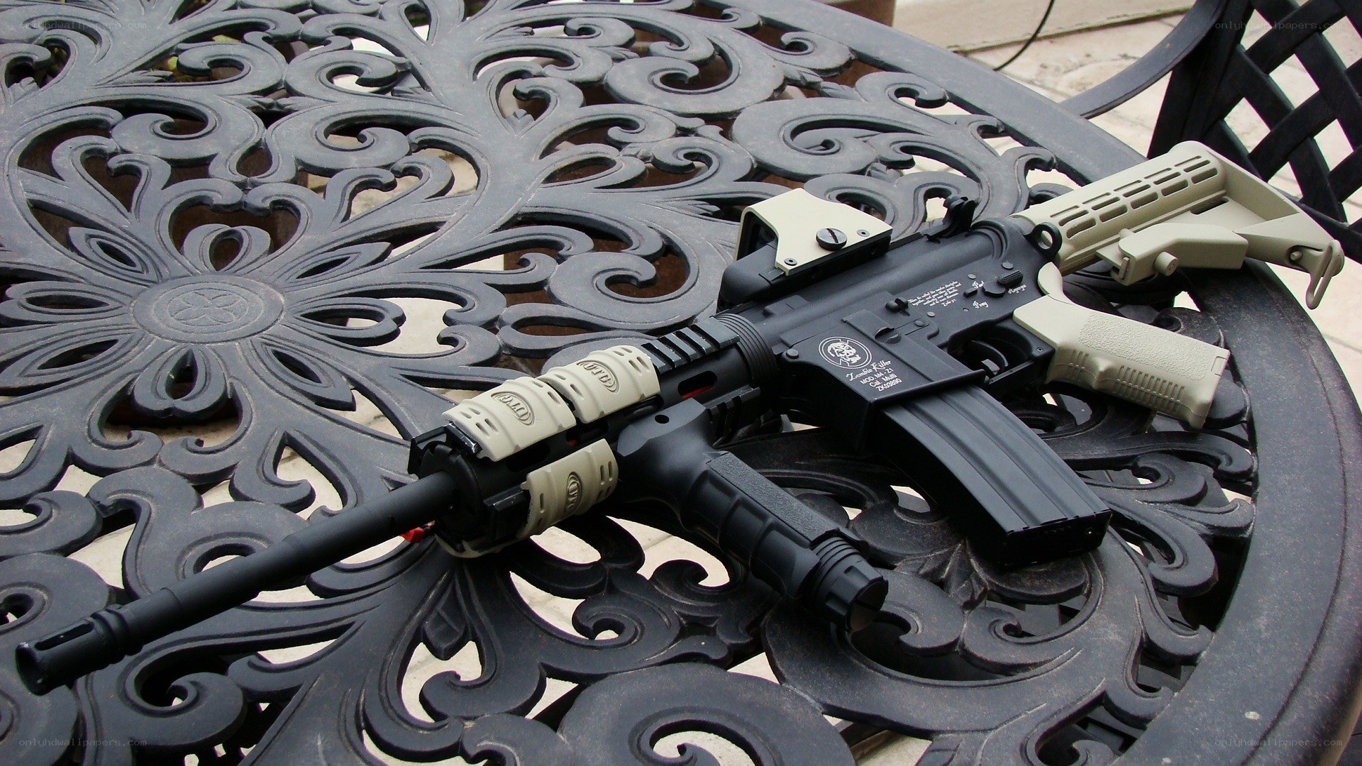 airsoft rifle on ornate table