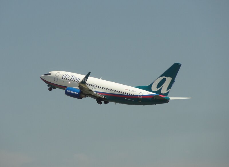 AirTran Airplane in Flight — White