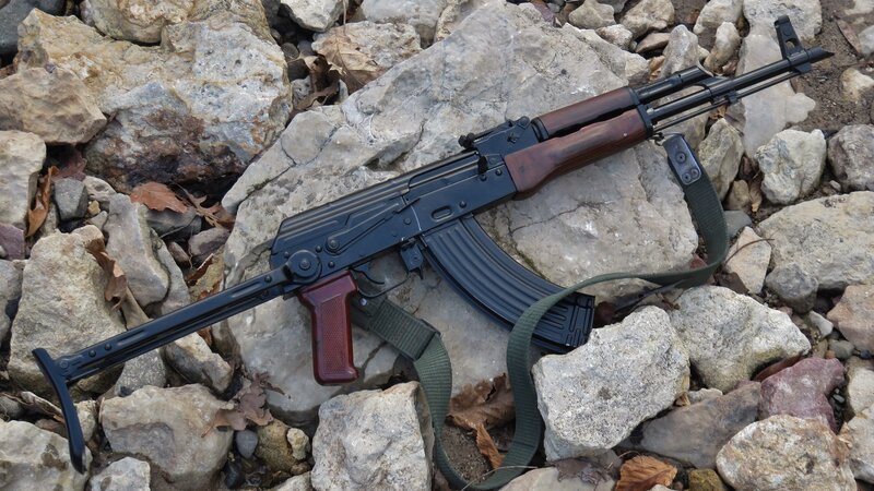 Ak-47 Rifle on Rocks