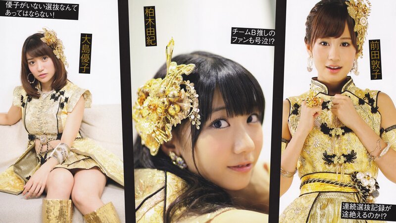 AKB48 members in gold outfits