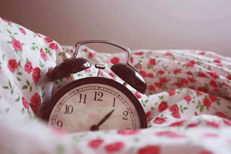 Alarm Clock on Floral Blanket