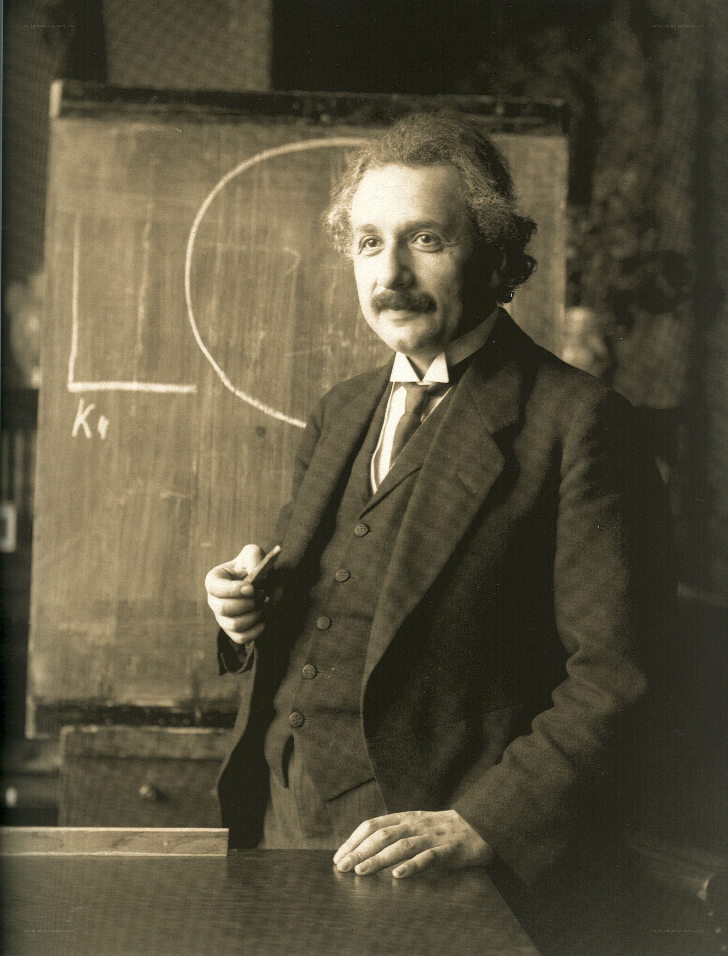Albert Einstein at a chalkboard