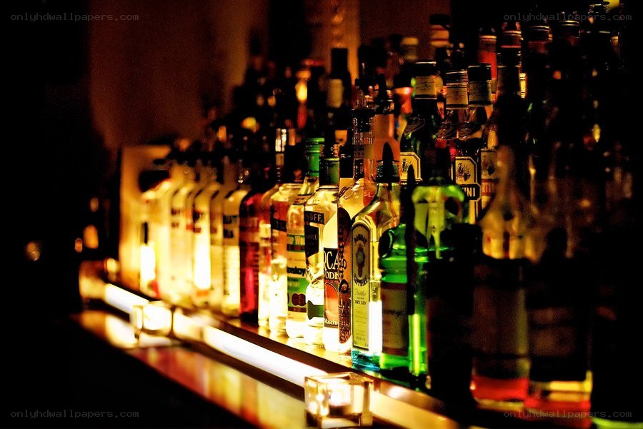 alcohol bottles on bar shelf