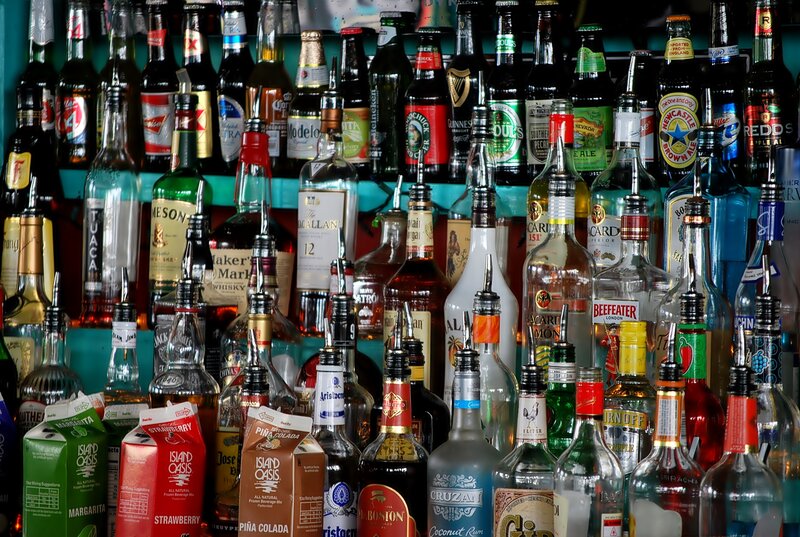 Alcohol Bottles on Shelf — Blue