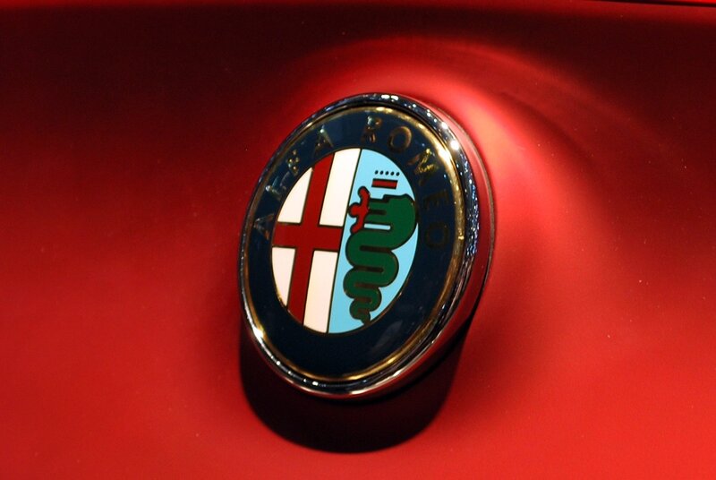 Alfa Romeo emblem on red car