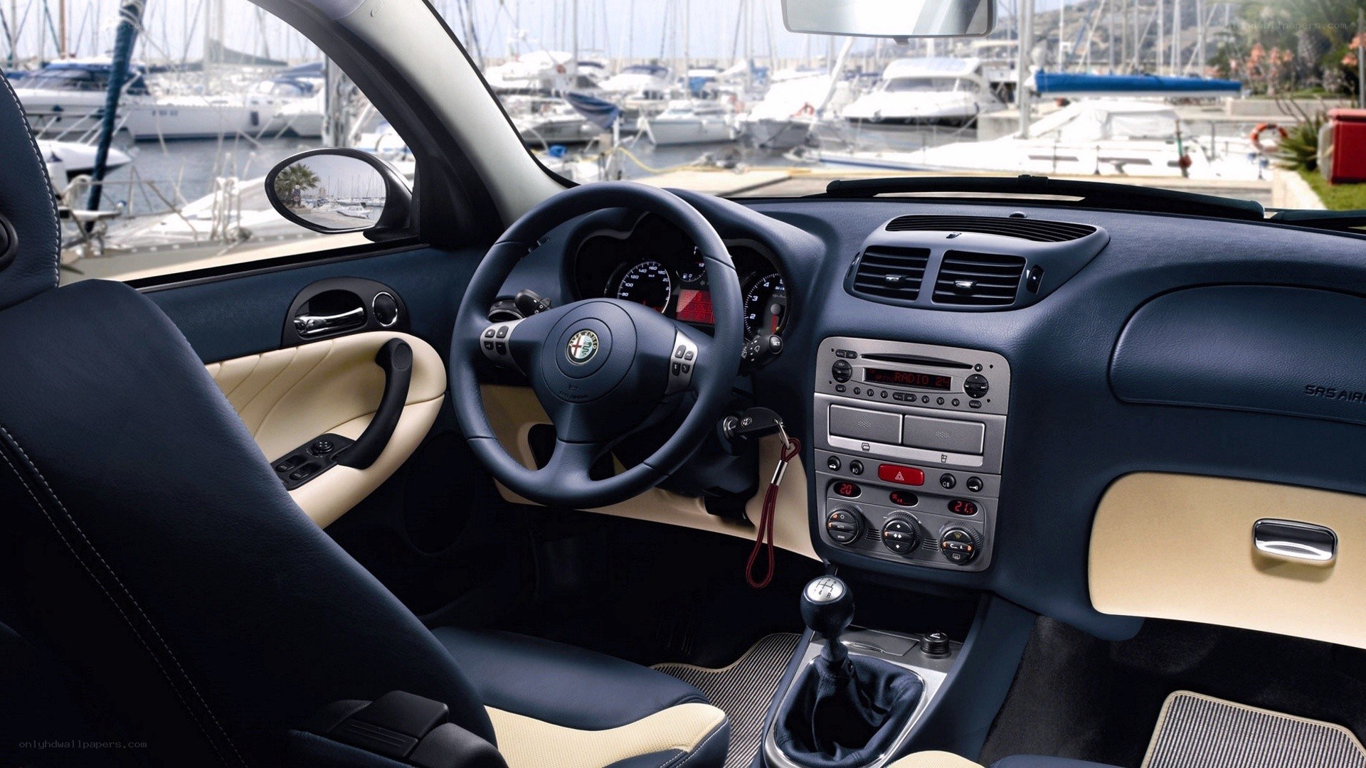 Alfa Romeo interior with marina view