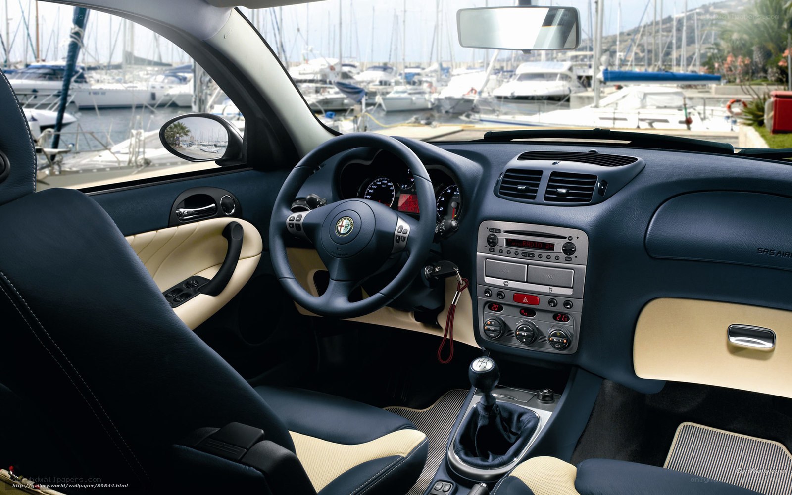 Alfa Romeo interior with marina view