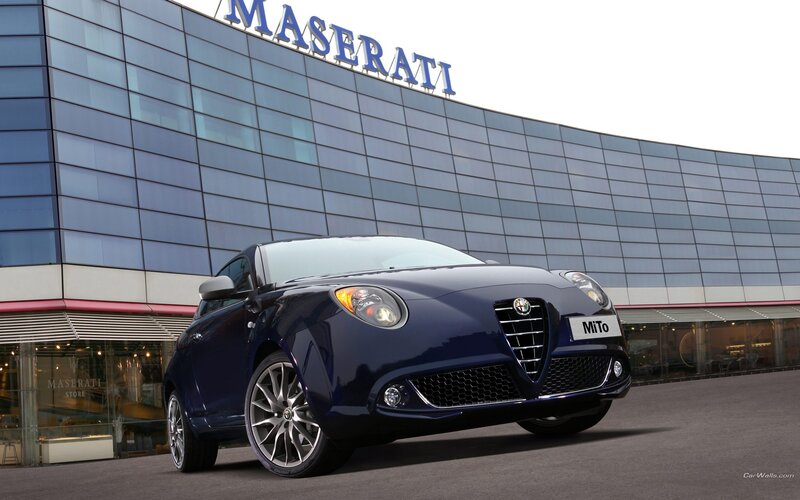 Alfa Romeo MiTo in front of Maserati building