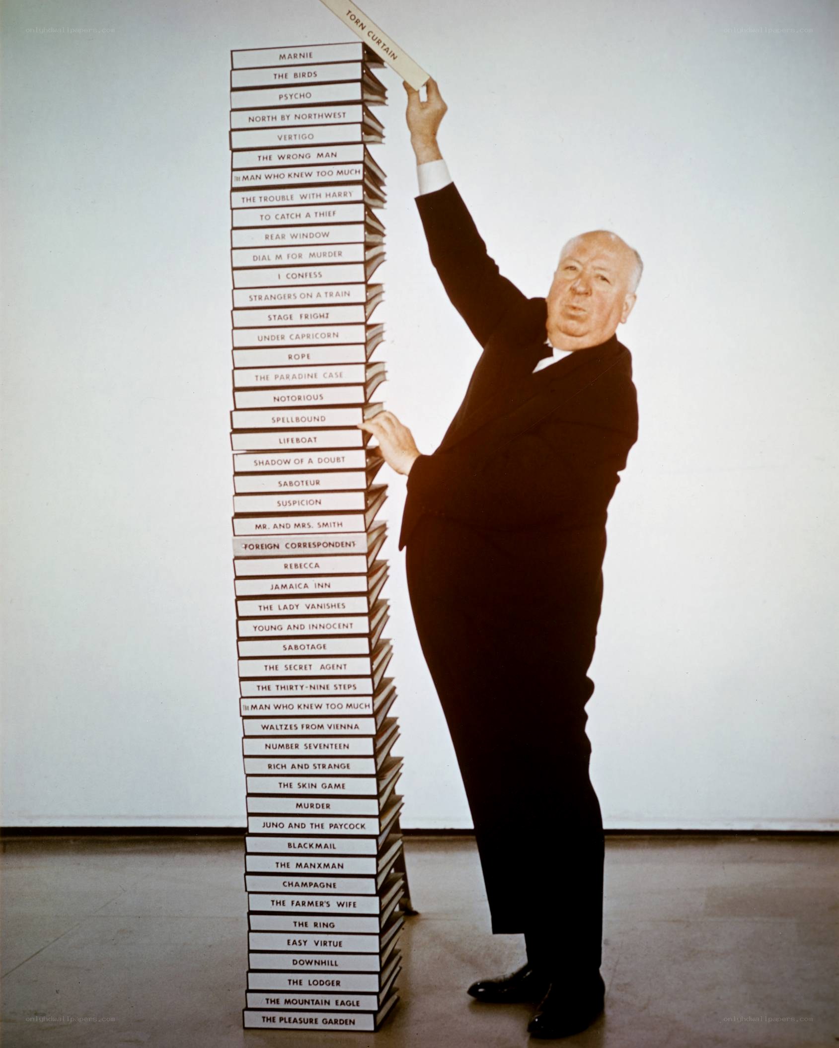 Alfred Hitchcock with book stack