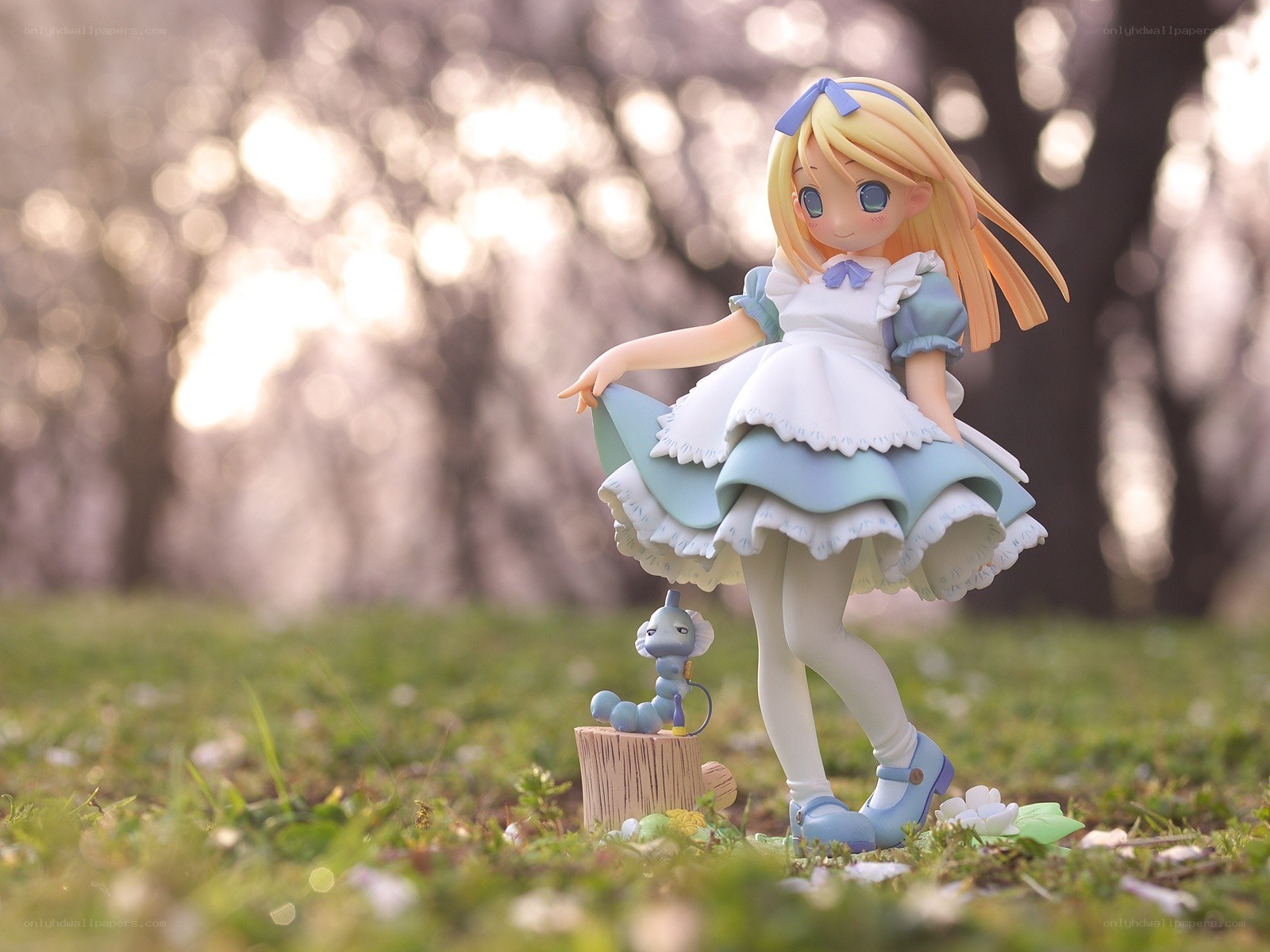 Alice figurine in garden