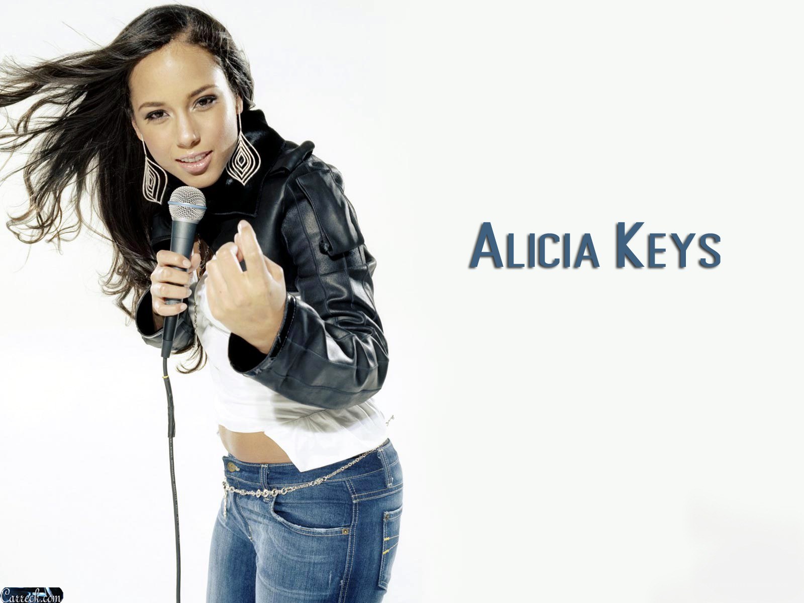 Alicia Keys singing into microphone