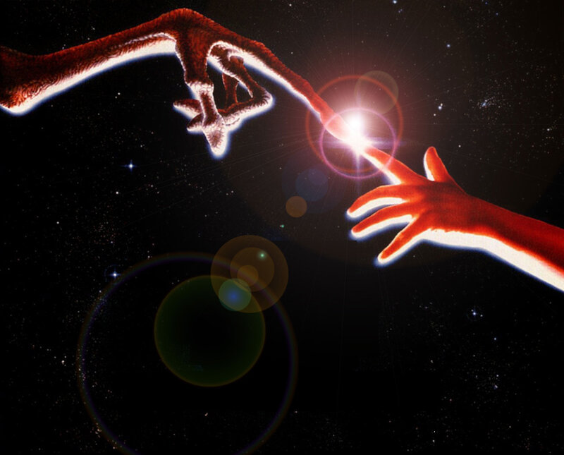 alien and human hands touching