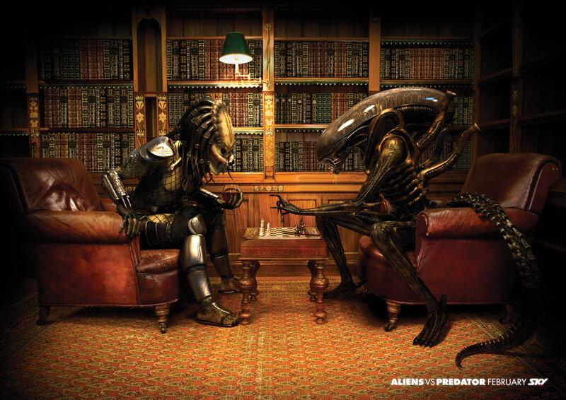 Alien and Predator Playing Chess