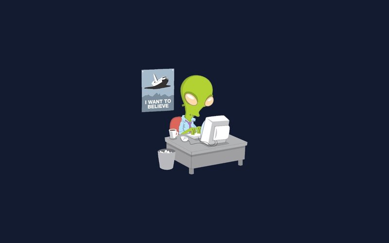 alien at a computer desk