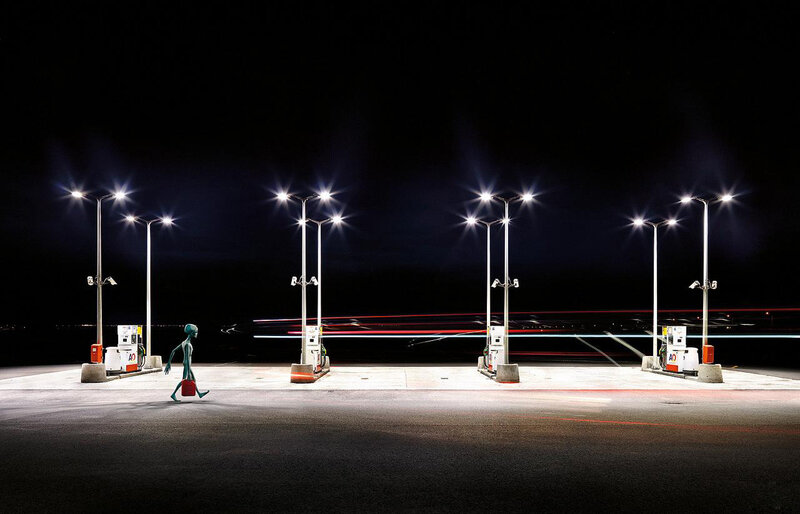 alien at gas station at night