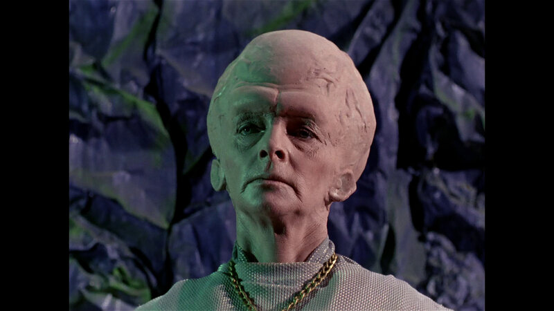 alien character in green light