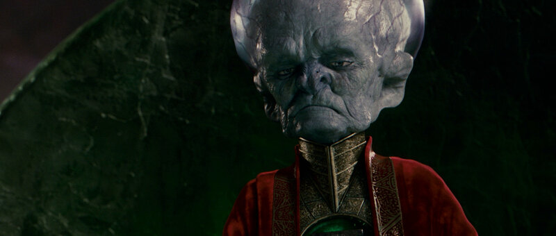 alien character in red robe