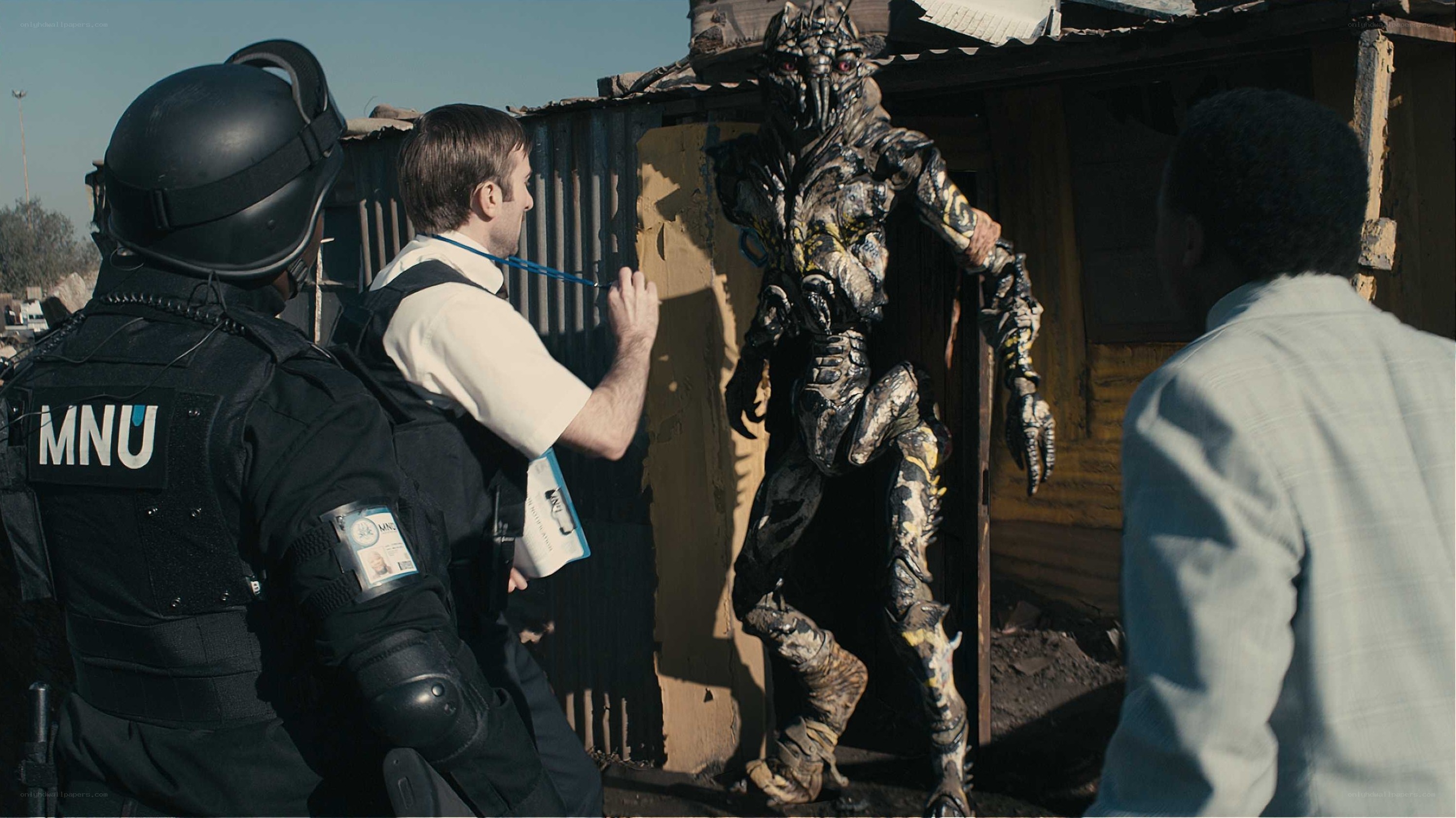 Alien creature confronts humans