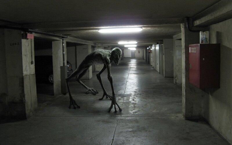 Alien Creature in Garage — Gray, Dark, Night, Photograph
