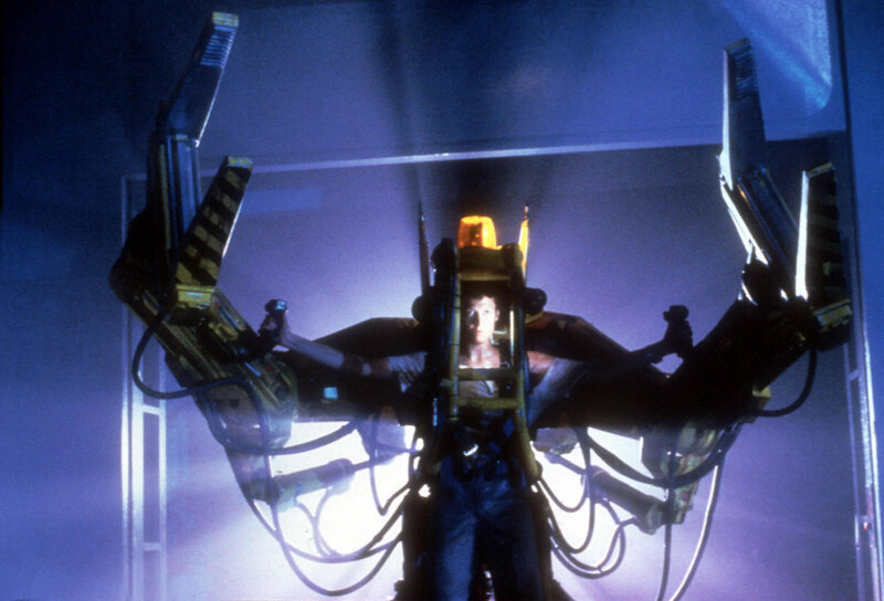Alien creature in mechanical harness