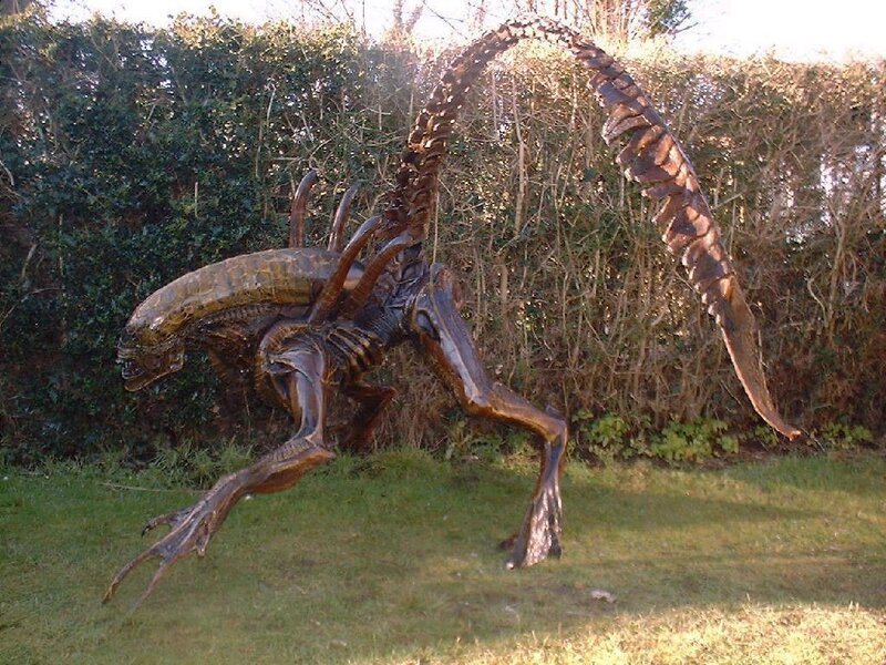 Alien creature sculpture in garden