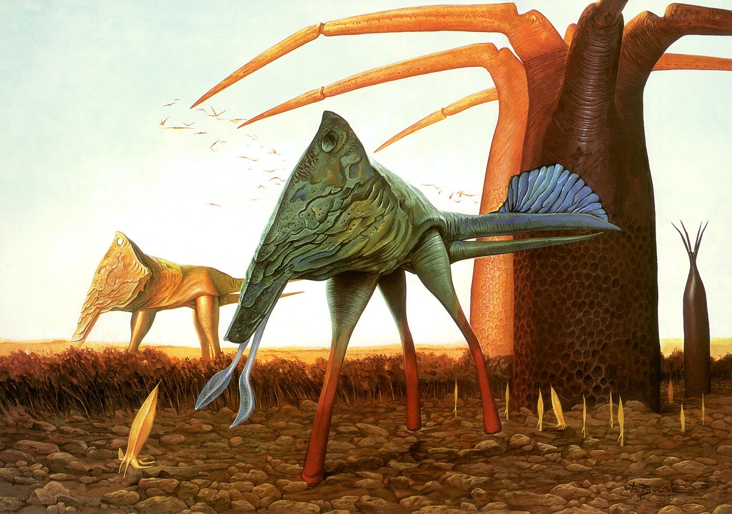 Alien creatures in a barren landscape