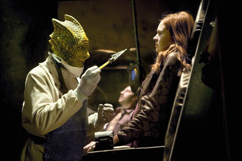Alien doctor examines woman